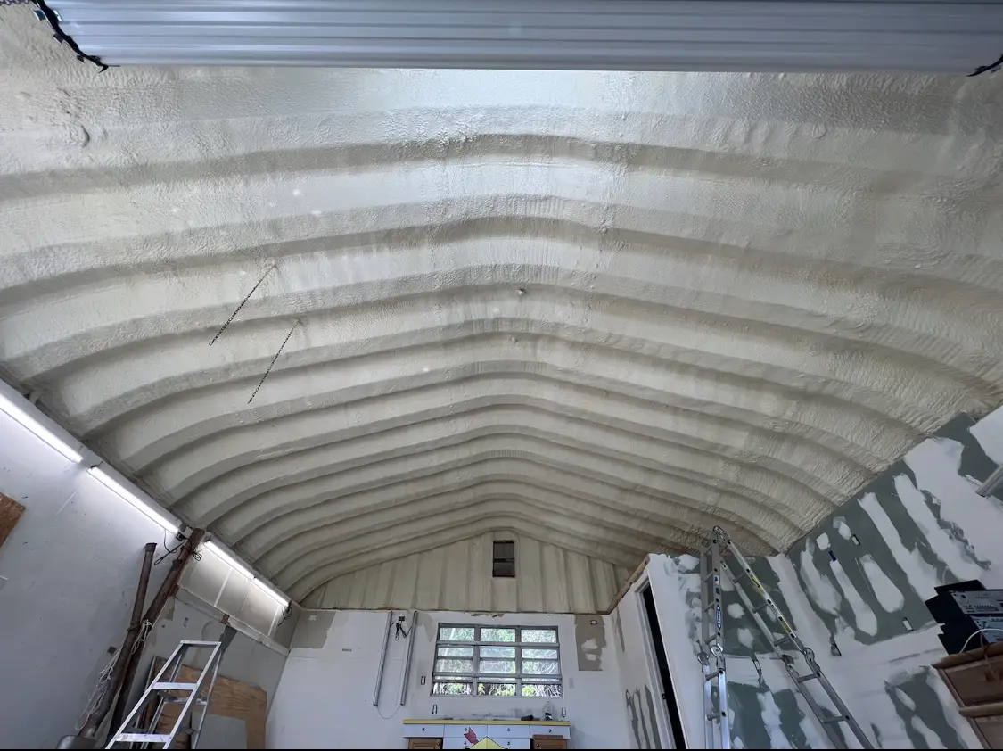 Spray polyurethane foam applied to the underside of a metal roof deck in Tonganoxie